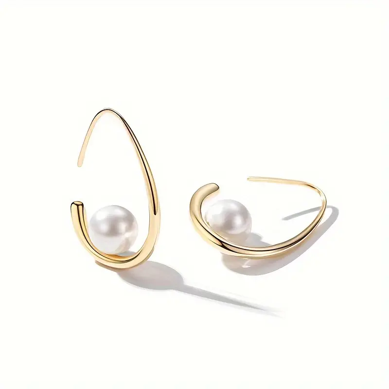 Eleganta örhängen i pärla och guld
